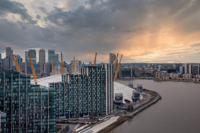 View from the river thames over millennium dome or o2 arena in london.