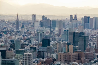 High angle view of buildings in city against sky