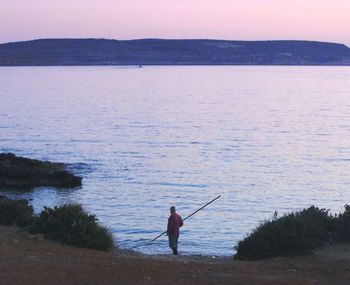 Woman standing on beach