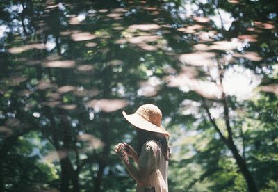 Woman with umbrella on tree