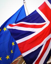 Close-up of flag against blue sky