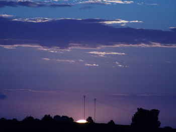 Silhouette of trees against sky at sunset