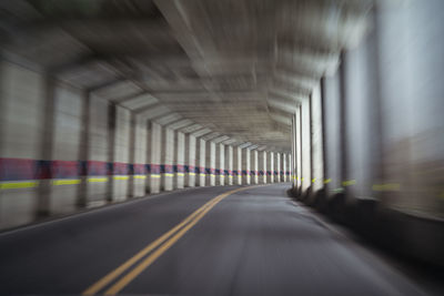 Blurred empty road with columns and concrete ceiling located in alishan township in taiwan