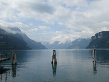 Scenic view of lake and mountains against sky