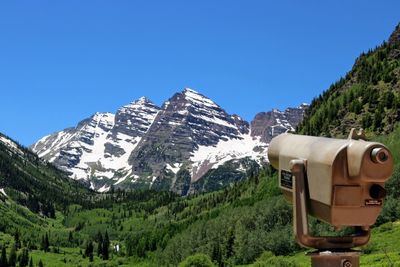 Scenic view of mountains against clear blue sky