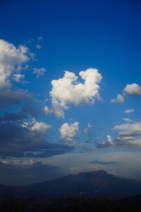 Low angle view of clouds over landscape