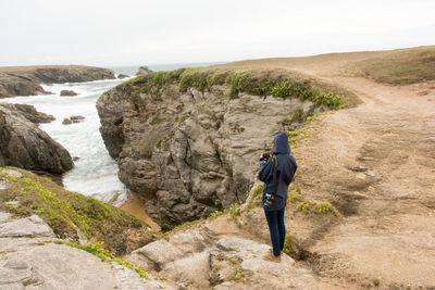 Man standing on rock formation