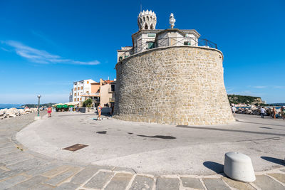 View of historical building against blue sky