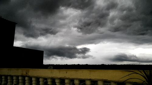 Low angle view of building against cloudy sky