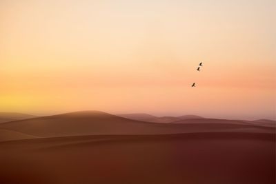 Scenic view of mountains against sky during sunset