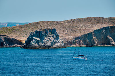 Scenic view of sea against clear blue sky