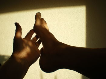 Close-up of human hand with shadow