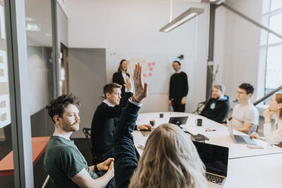 People having presentation during business meeting