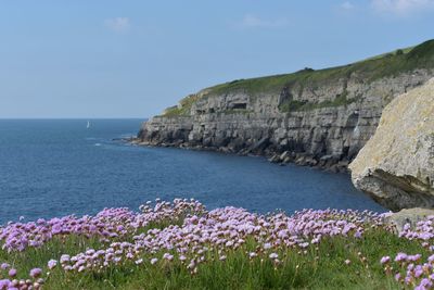 Scenic view of sea and rocks against sky