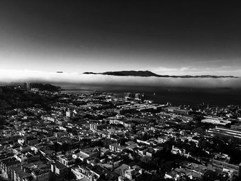 Aerial view of town against sky at night