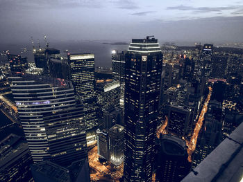 Illuminated cityscape against sky