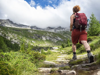 Trekking scene in the italian alps of val masino