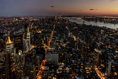 Aerial view of city lit up at night