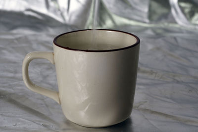Close-up of coffee cup on table