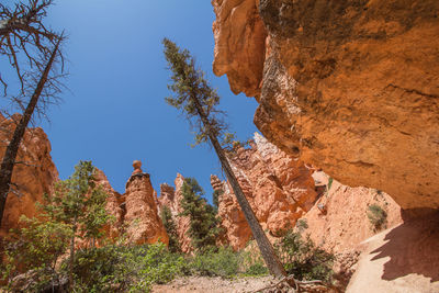 Low angle view of rock formation against sky