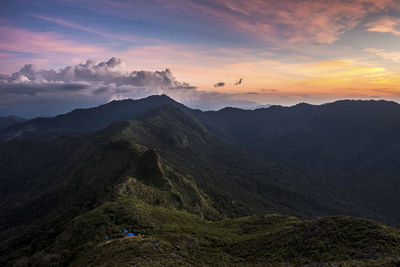 Scenic view of mountains against sky during sunset