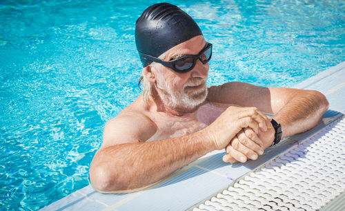 Man swimming in pool