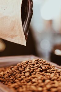 Close-up of roasted coffee beans on table