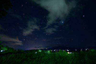 Scenic view of field against sky at night