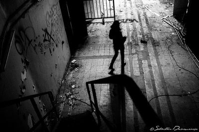 High angle view of man walking on street