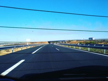 Road seen through car windshield