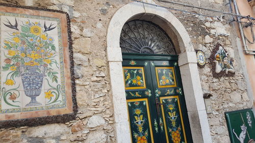 Low angle view of window on old building