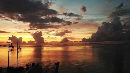 Scenic view of lake against sky during sunset