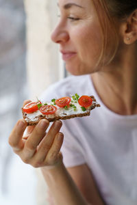 Close-up of woman holding food