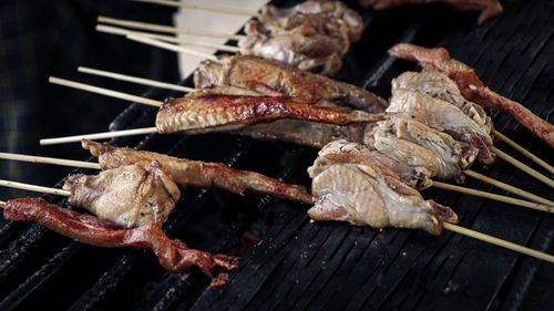 Close-up of meat on barbecue grill