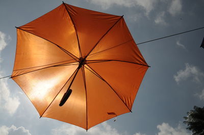 Low angle view of umbrella against sky