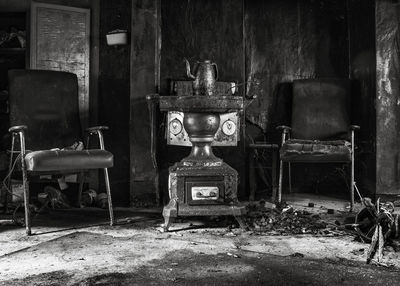 Empty chairs and tables in abandoned building