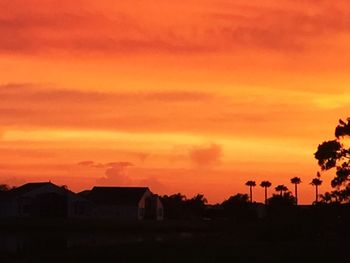 Silhouette of built structure at sunset