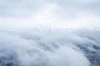 Cloudscape over city against sky