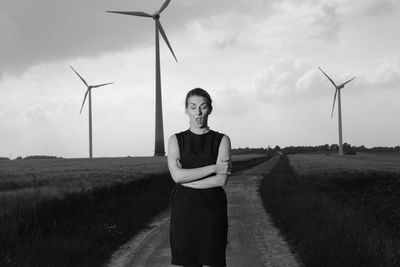 Full length of man standing on field against sky