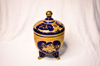 Close-up of illuminated lamp on table