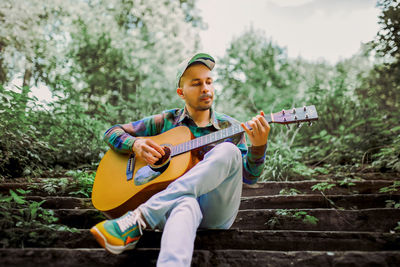 Young man playing guitar