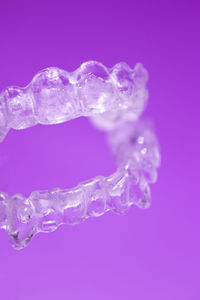 Close-up of frozen water against blue background