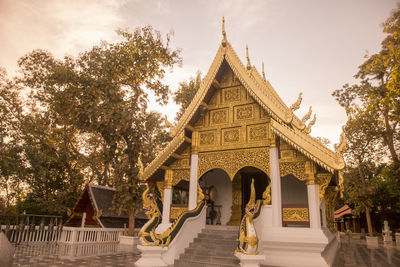 View of temple against building