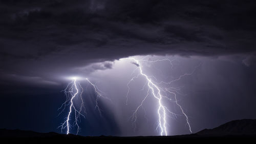 Lightning illuminates a rain shaft from a monsoon thunderstorm near gila bend, arizona.