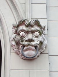 Close-up of animal sculpture on wall