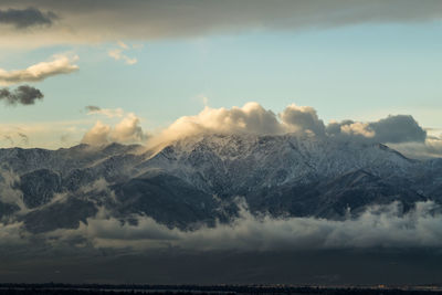 Scenic view of snowcapped mountains against sky