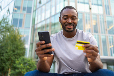 Young man using mobile phone