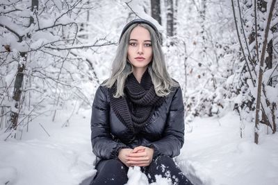 Portrait of beautiful woman in snow