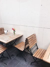 High angle view of potted plants on table against wall