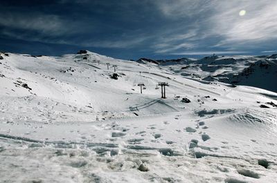 Scenic view of snow covered mountains